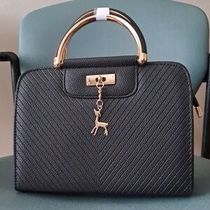 Elegant Black Handbag with Gold Accents